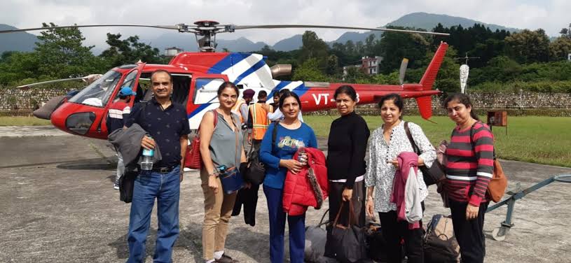 Travellers at helipad